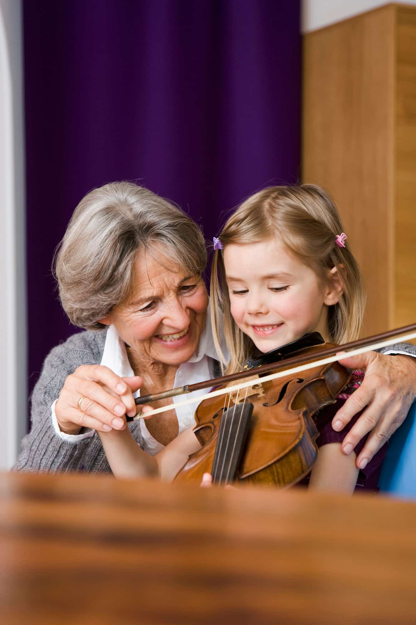 grandma teaching grandchild music
